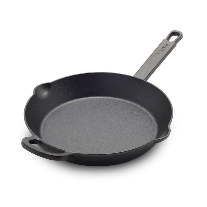 The Bobby Flay by GreenPan 10" Cast Iron Frypan, shown in black with a long handle and small helper handle, features two pouring spouts and a spacious cooking surface ideal for everyday use.