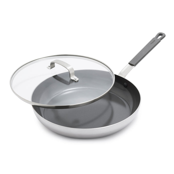 GreenPan 12-inch black nonstick frypan with glass lid, lid partially open, on a white background.