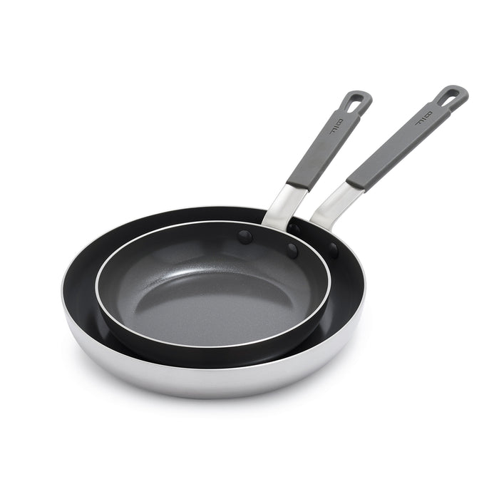 Set of two stainless steel frypans with gray handles on a white background, sizes 8-inch and 10-inch.