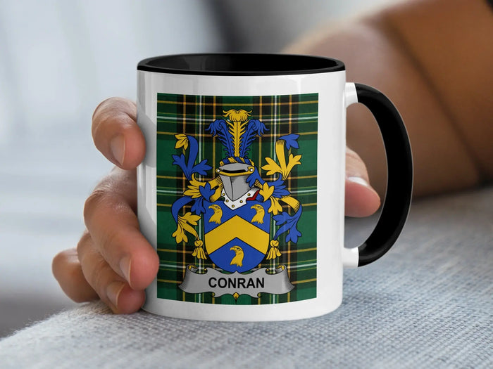 Conran Irish surname mug with family crest on an Irish National Tartan background.