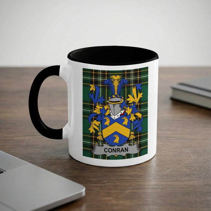 Conran 11oz ceramic mug with black rim and surname emblem on Irish tartan.