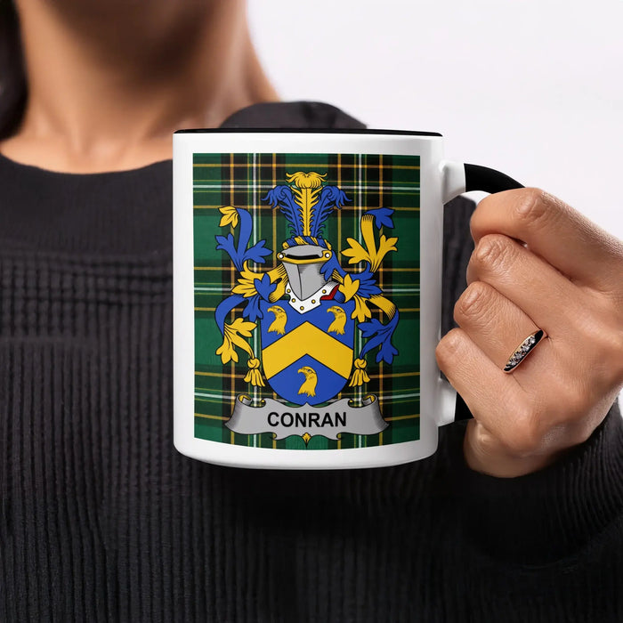 Conran heritage mug featuring the family crest, black handle and tartan design.