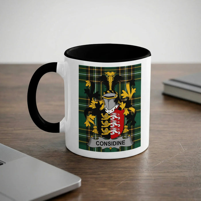 Considine 11oz ceramic mug with black rim and surname emblem on Irish tartan.
