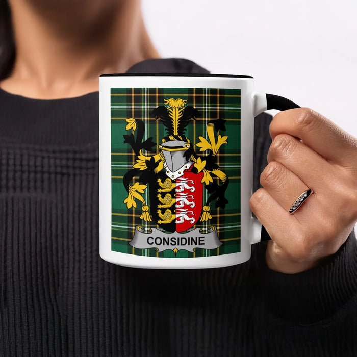 Considine heritage mug featuring the family crest, black handle and tartan design.