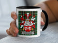 Corcoran Irish surname mug with family crest on an Irish National Tartan background.