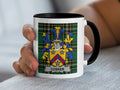 White mug with black rim displaying the Cosker family crest on a plaid background.