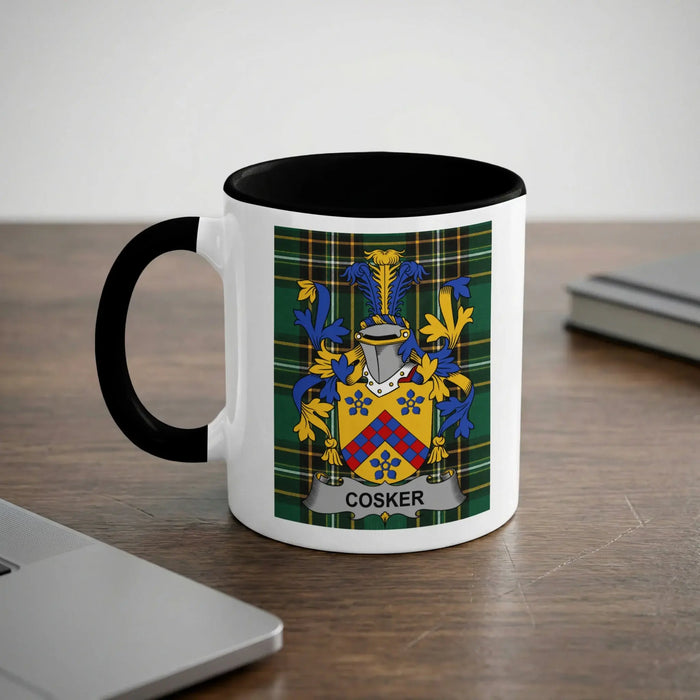 White mug with black rim and handle, featuring the Cosker family crest.