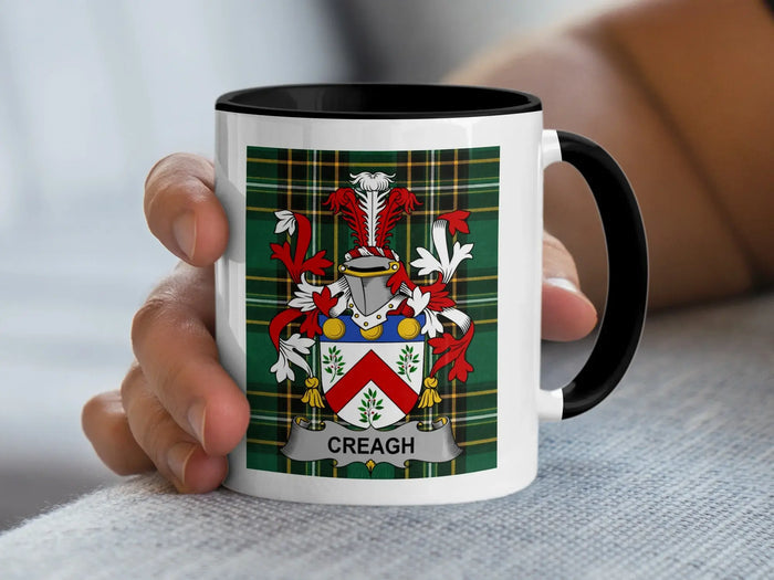 Creagh Irish family crest accent mug with a black rim and handle