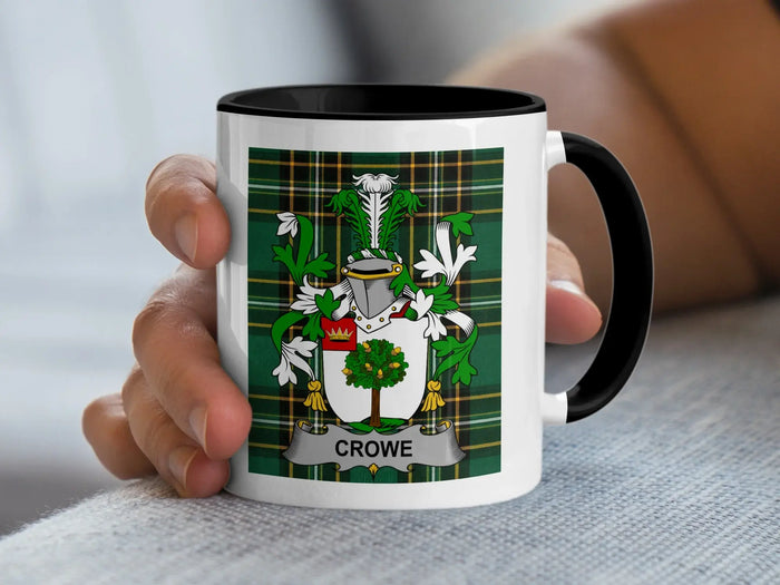 White mug with black rim displaying a green tartan shield and the name Crowe.