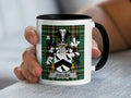 White mug with black handle featuring green plaid and a family crest with "CULLEN" text.