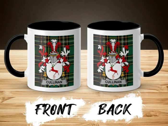 White mug with black handle, featuring a family crest with a red stag.