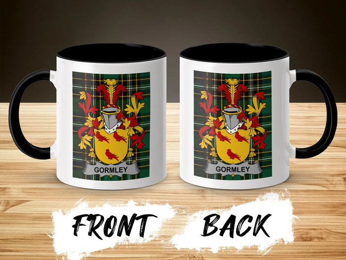 Two mugs with Gormley crest on wood background, front and back view.