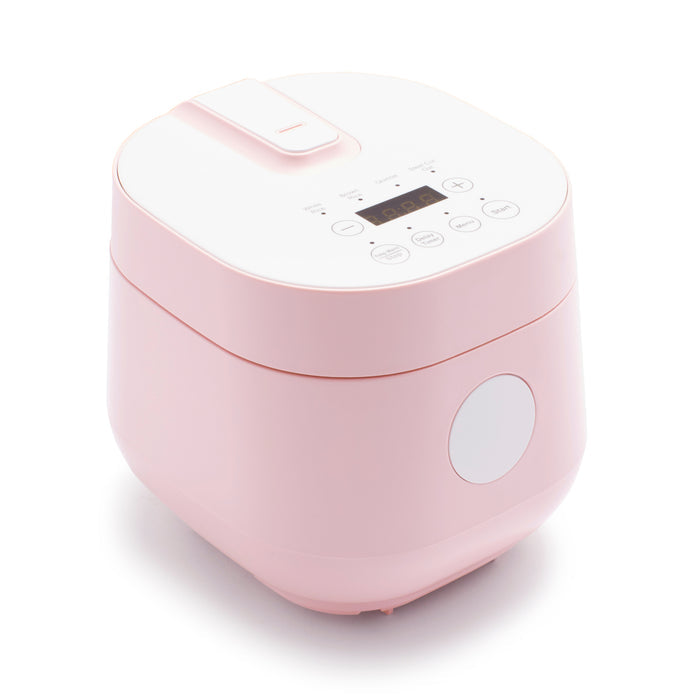 Pink 4-cup rice and grains cooker with ceramic nonstick pot, digital display, and control buttons.