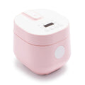 Pink 4-cup rice and grains cooker with ceramic nonstick pot, digital display, and control buttons.