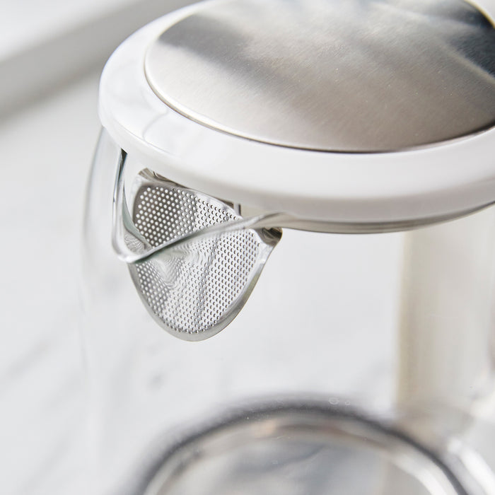 GreenLife glass kettle spout with mesh filter, stainless steel lid, clear body, and 1.7L capacity shown close up.