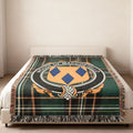 MacCostello family crest emblem woven blanket displayed on a bed