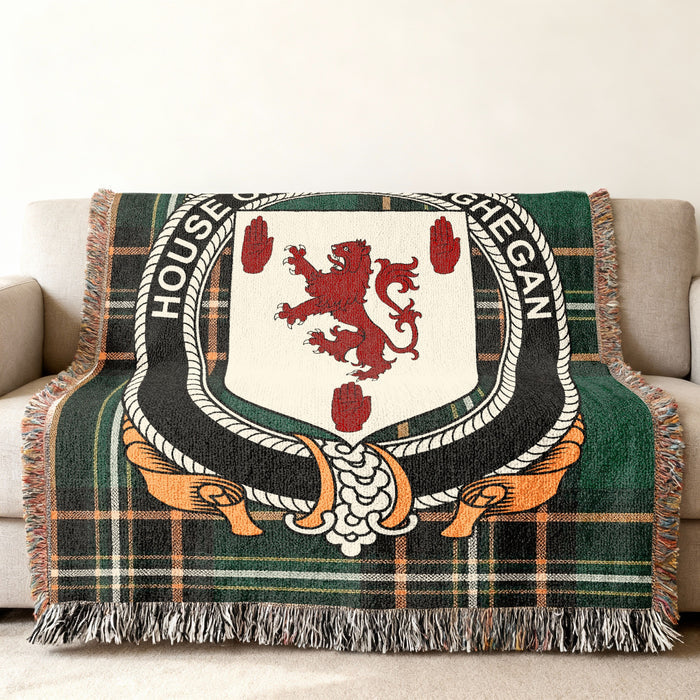 Maceoghegan Irish National Tartan woven blanket displayed on a sofa