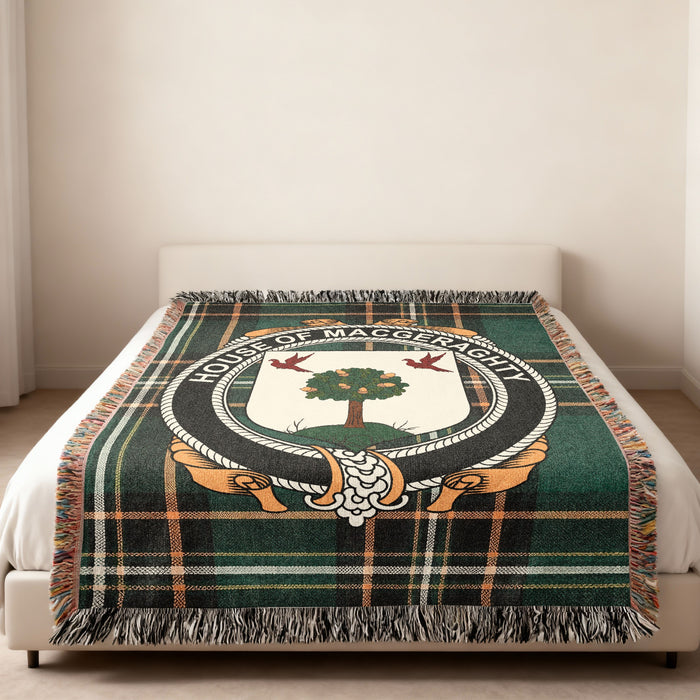 MacGeraghty family crest emblem woven blanket displayed on a bed
