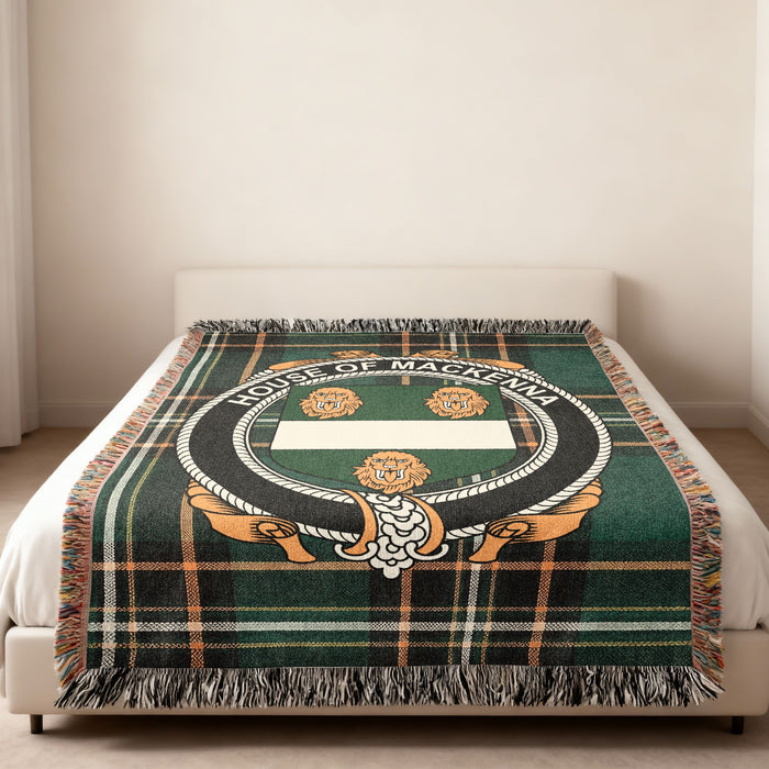 MacKenna family crest emblem woven blanket displayed on a bed