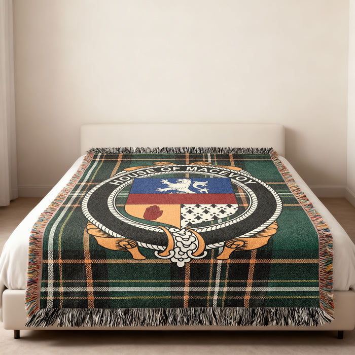 McEvoy family crest emblem woven blanket displayed on a bed