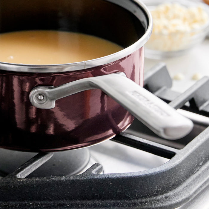 Chocolate brown 2-quart saucepan with handle, smooth finish, and matching lid.