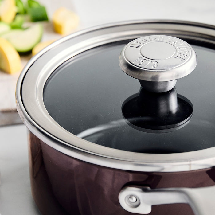 Chocolate brown enameled steel saucepan with matching lid, 2-quart capacity.