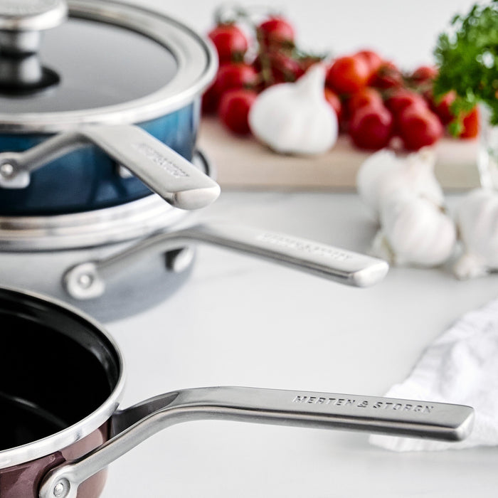 Steel core enameled 2-quart sauté pan with lid in chocolate truffle, showing both handles.
