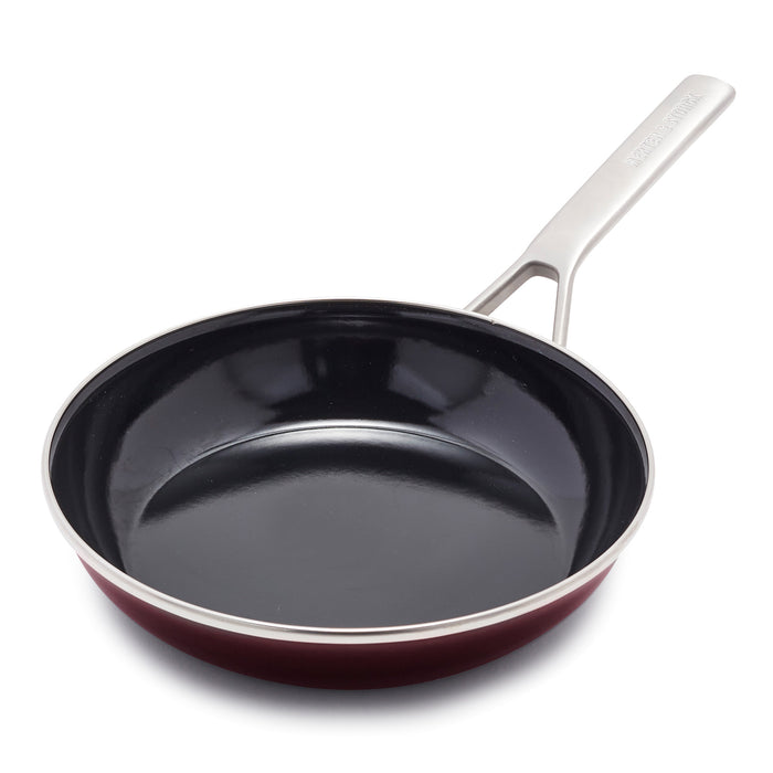 Chocolate brown enameled steel frypan with handle, viewed from above on a white background.