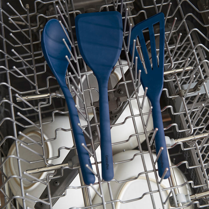 Navy blue silicone pasta tongs with metal handle, single piece shown.