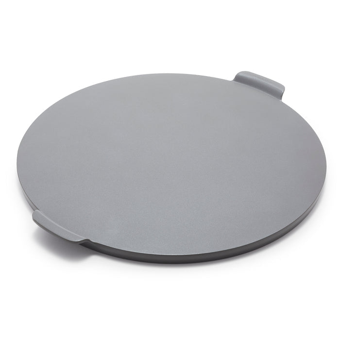 Gray round pizza baker with two small handles, ceramic material, shown on a white background.