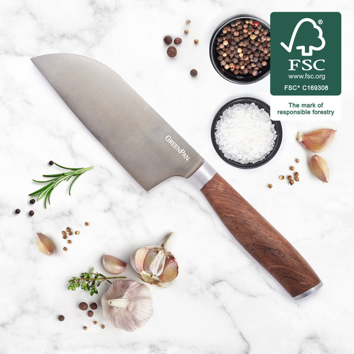 Small Santoku knife with a walnut handle, beside garlic, rosemary, assorted spices, and an FSC certification logo.