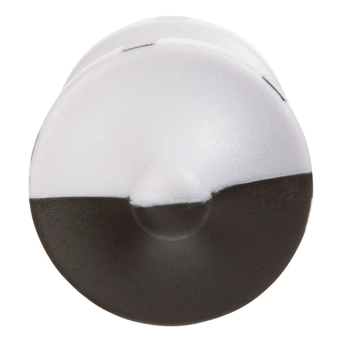 Close-up view of the Project Blueprint Magnetic Levitator by Project Blueprint, featuring a black and white cylindrical design with a rounded tip, split horizontally into two contrasting halves.