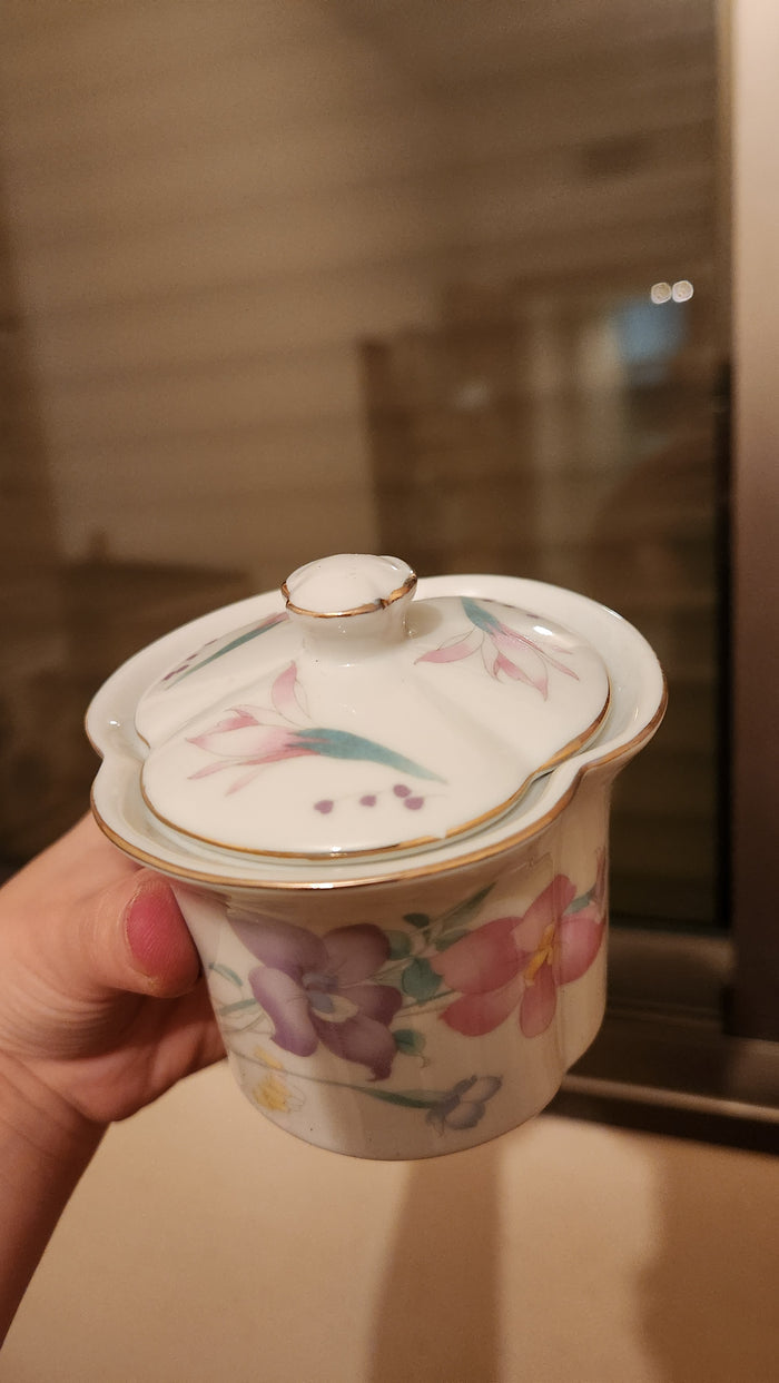 set of milk pitcher and a sugar bowl