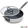 Stainless steel sauté pan with black handles, ceramic nonstick interior, glass lid, 4-quart capacity.