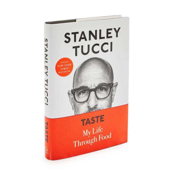 Taste: My Life Through Food hardcover cookbook with Stanley Tuccis photo and red accents on the cover.