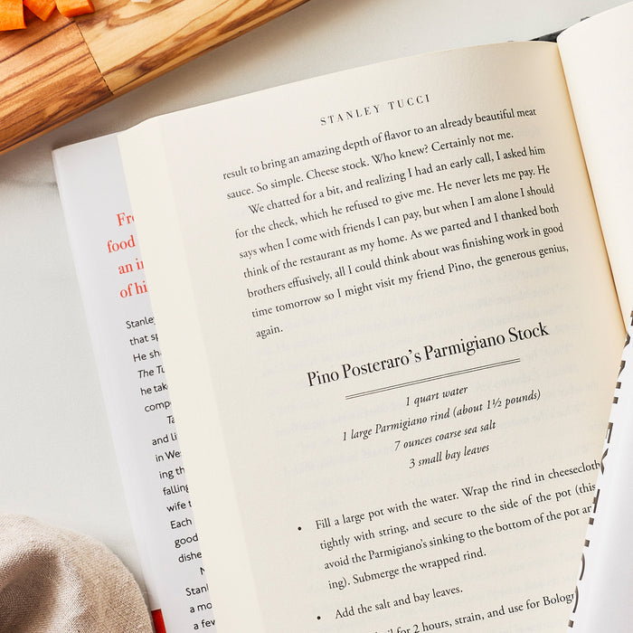 Taste: My Life Through Food cookbook open to Parmigiano Stock recipe by Pino Posteraro, text and ingredients visible on the page.