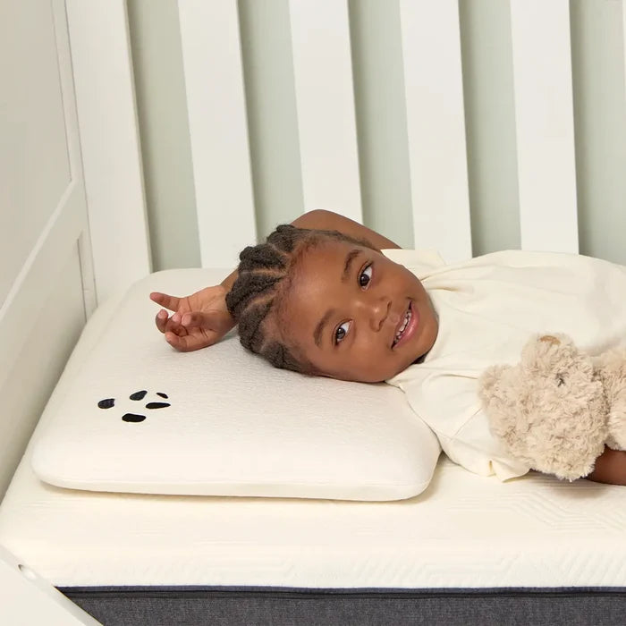 Kid laying on a Toddler Bamboo Panda Pillow