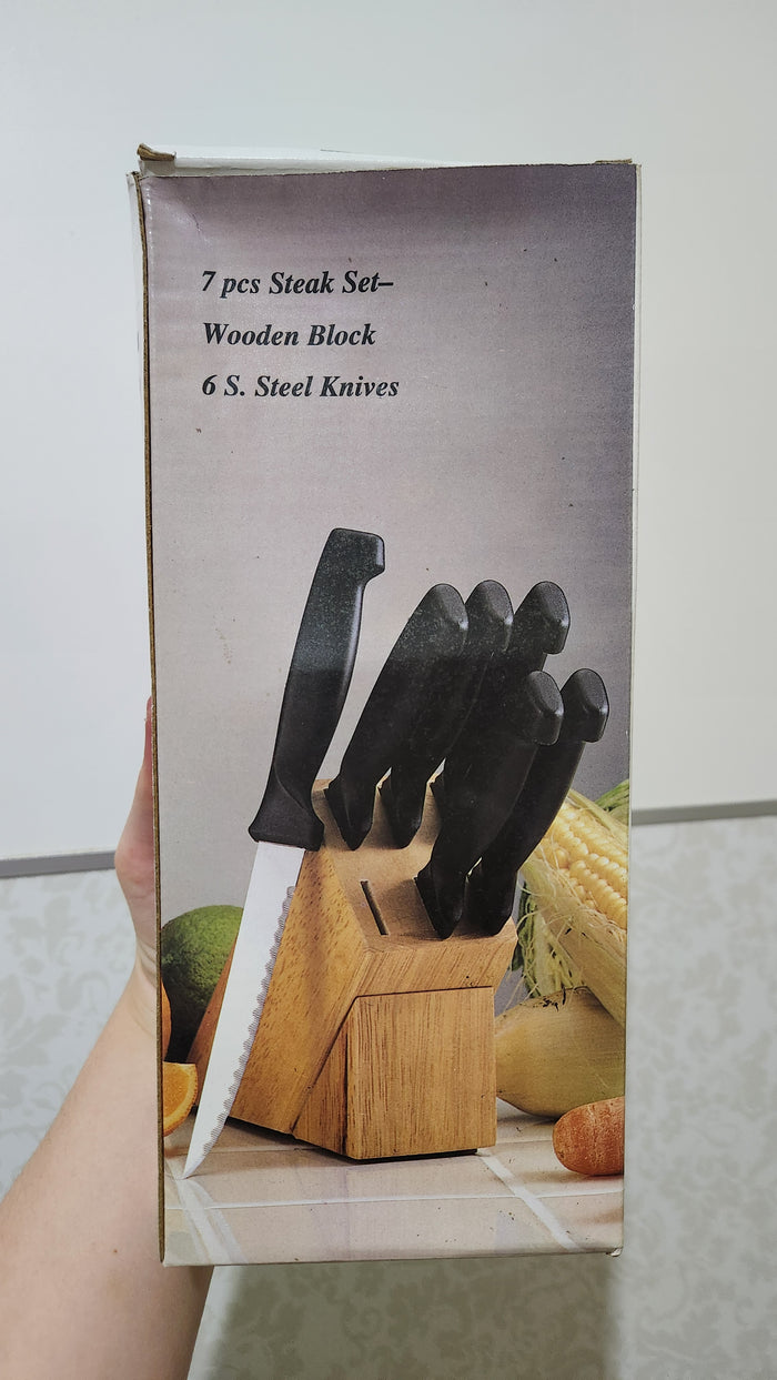 Tramontina 7-piece stainless steel steak knives set and a wooden block