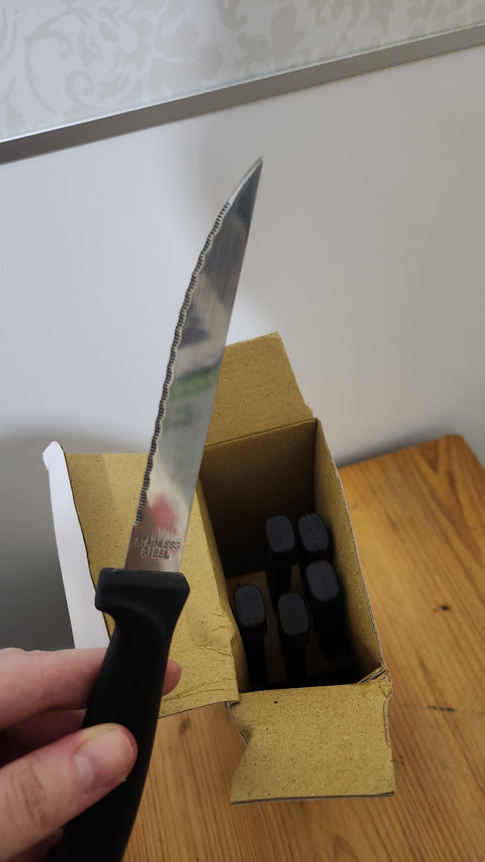 Tramontina 7-piece stainless steel steak knives set and a wooden block
