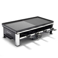 Rectangular cast aluminum grill with both grill and griddle surfaces, shown with eight spatulas underneath.