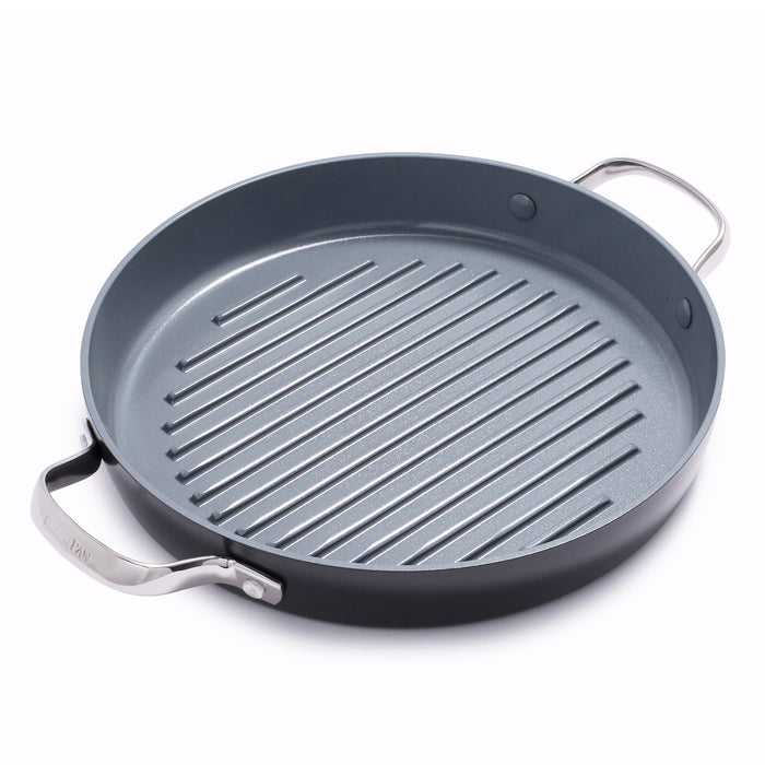 Round ceramic grill pan with raised ridges and two metal handles, single piece, dark finish.