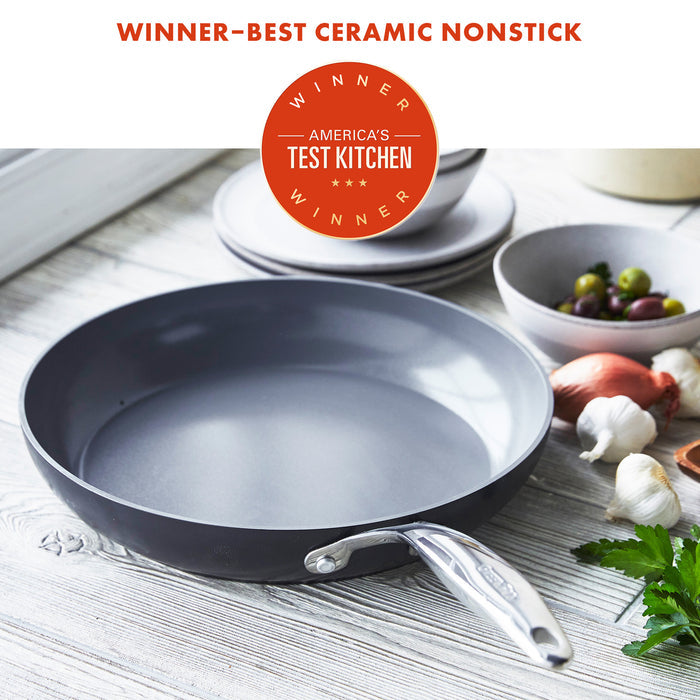 Ceramic nonstick 12-inch frypan on a kitchen counter with assorted vegetables nearby.